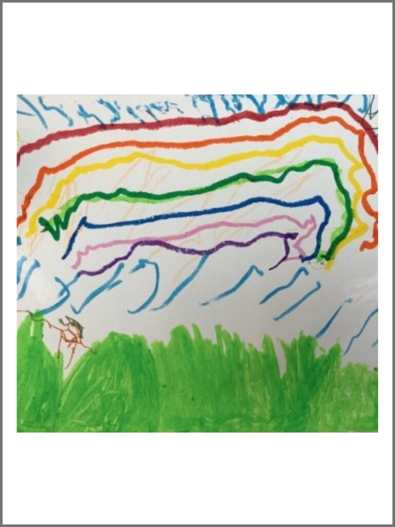 The picture has fresh green grass in the bottom third and a huge rainbow spreading over the top with rain falling on the grass.